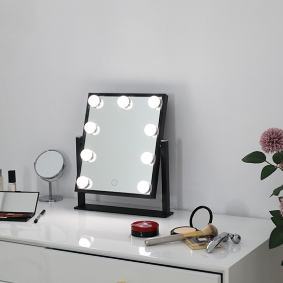 small mirror with lights