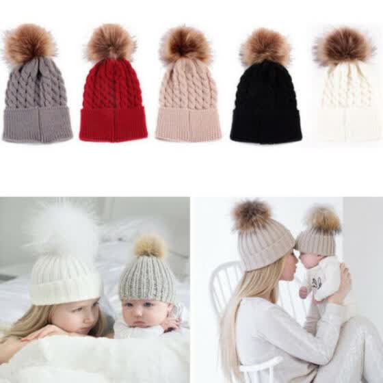 mother and baby matching bobble hats