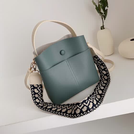 handbag with wide shoulder strap