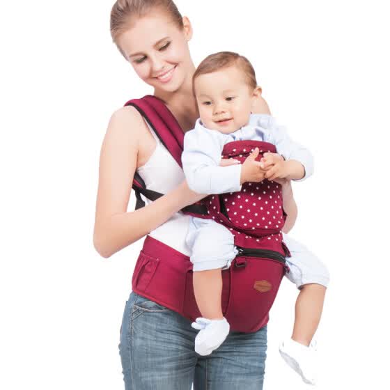 baby holding backpack